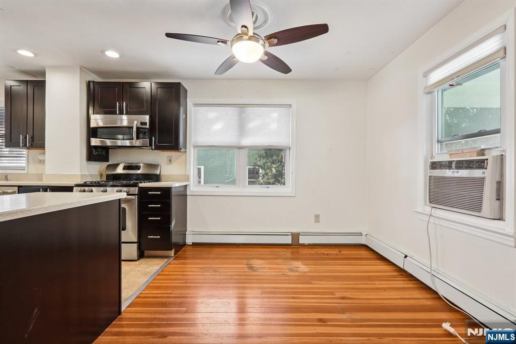 63 West Airmount Road Mahwah, NJ 07430 - Photo 9 of 20 a kitchen with stainless steel appliances granite countertop a stove a sink and a refrigerator