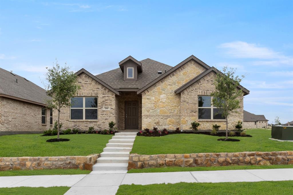 2841 Hay Lane Midlothian, TX 76065 - Photo 1 of 27 a front view of a house with a yard and garage