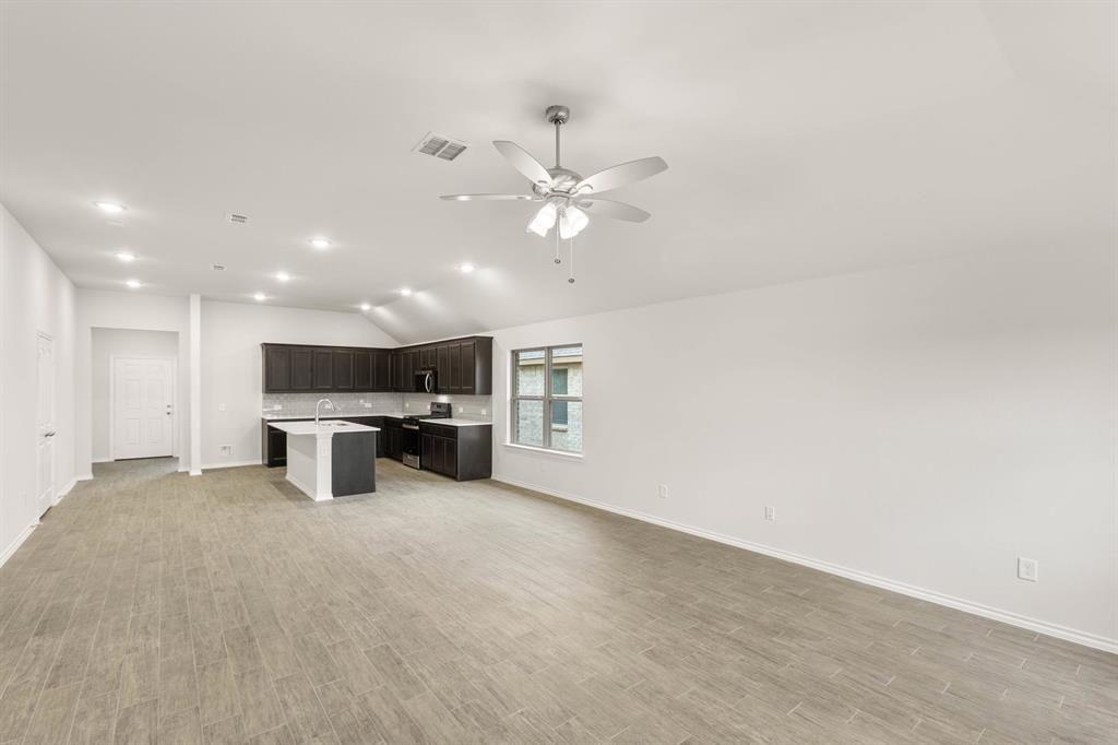 2841 Hay Lane Midlothian, TX 76065 - Photo 11 of 27 a view of a livingroom with a piano and wooden floor