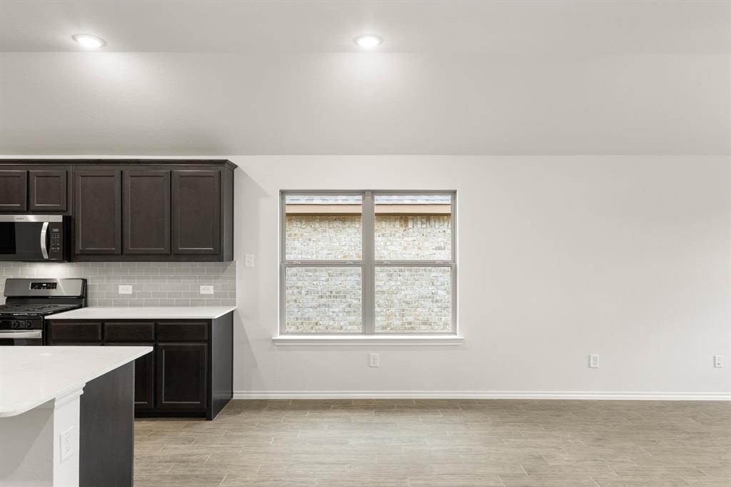 2841 Hay Lane Midlothian, TX 76065 - Photo 9 of 27 a view of a kitchen with microwave and cabinets