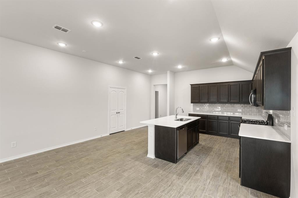 2841 Hay Lane Midlothian, TX 76065 - Photo 10 of 27 a large kitchen with a large counter top appliances and cabinets