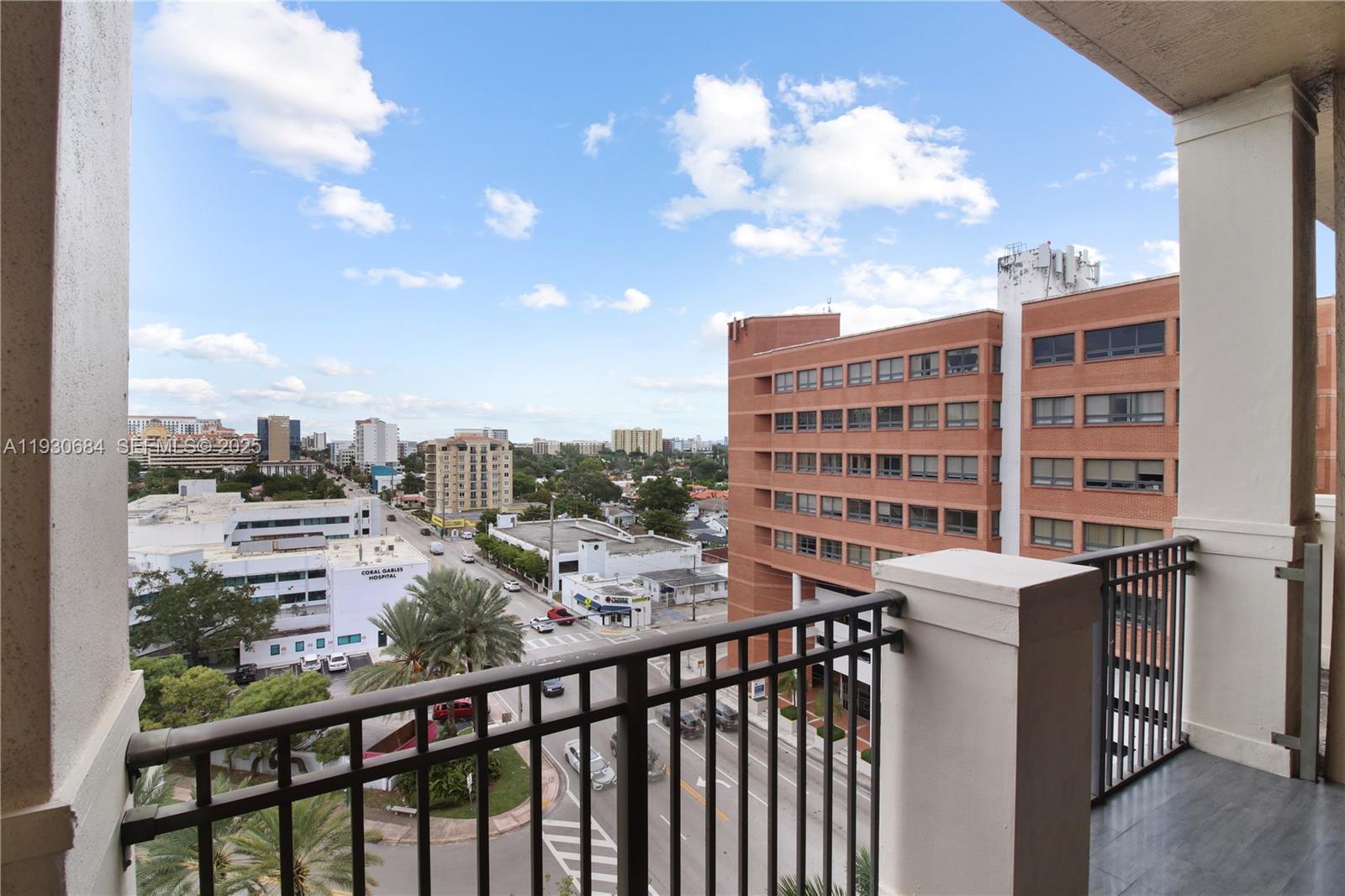 2650 Southwest 37th Avenue, Unit 901 Miami, FL 33134 - Photo 13 of 31 a view of a city from a balcony