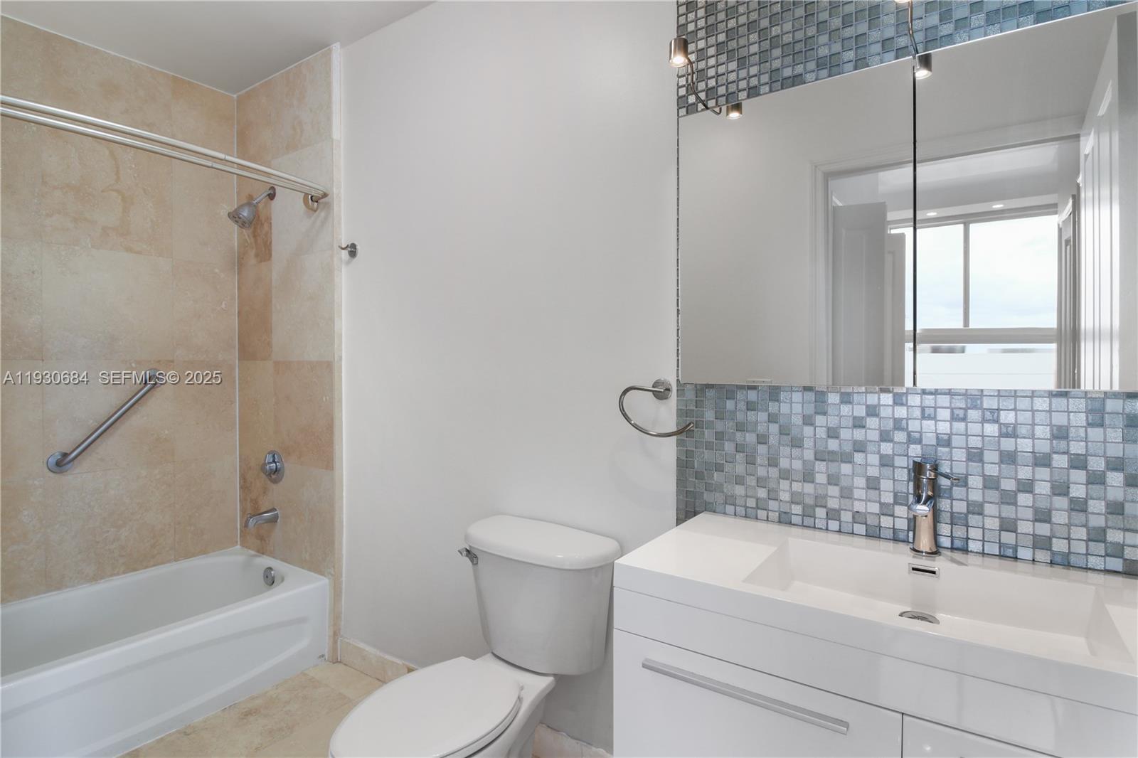 2650 Southwest 37th Avenue, Unit 901 Miami, FL 33134 - Photo 21 of 31 a bathroom with a sink toilet and shower