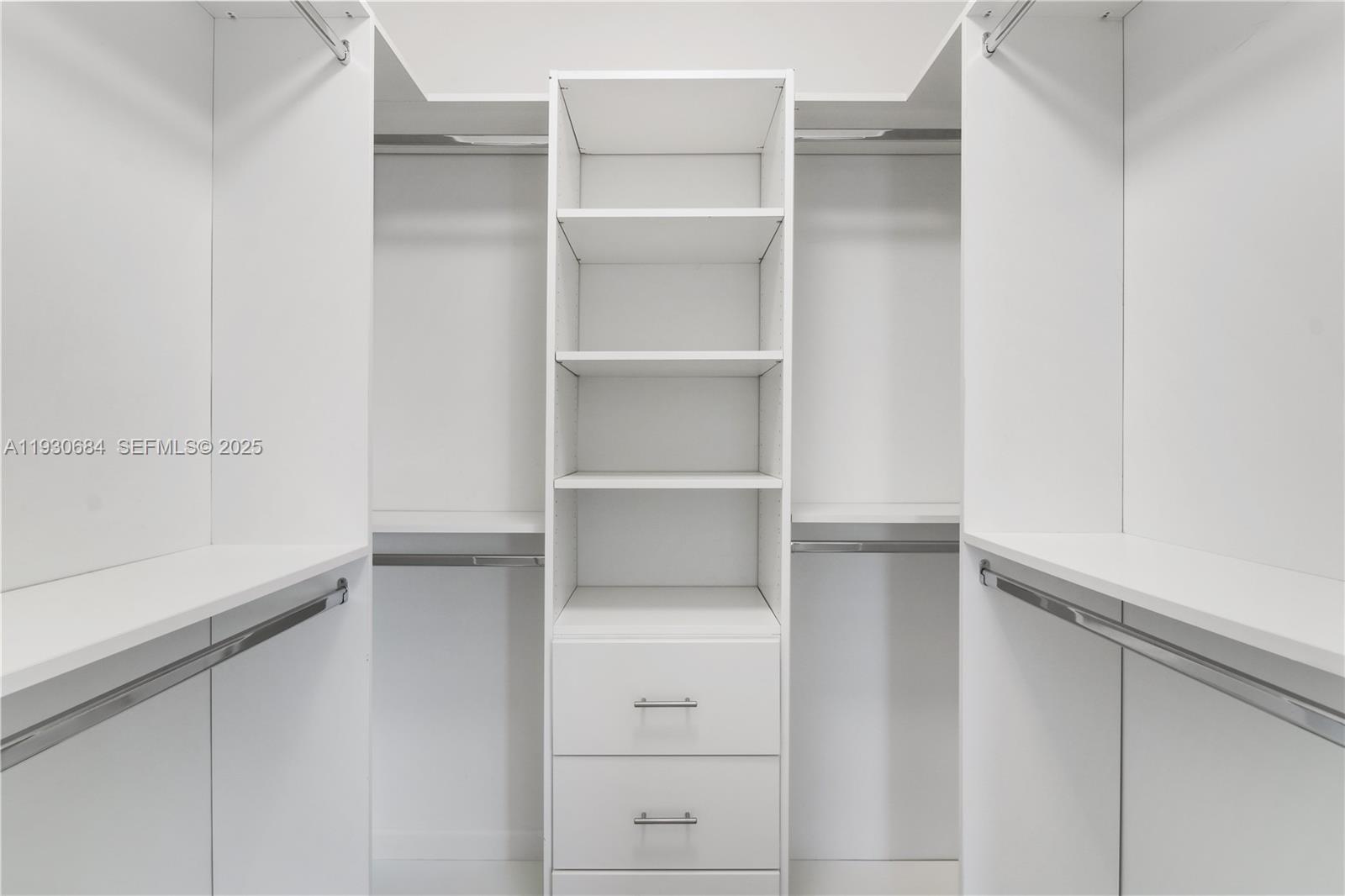 2650 Southwest 37th Avenue, Unit 901 Miami, FL 33134 - Photo 22 of 31 a view of walk in closet with empty racks