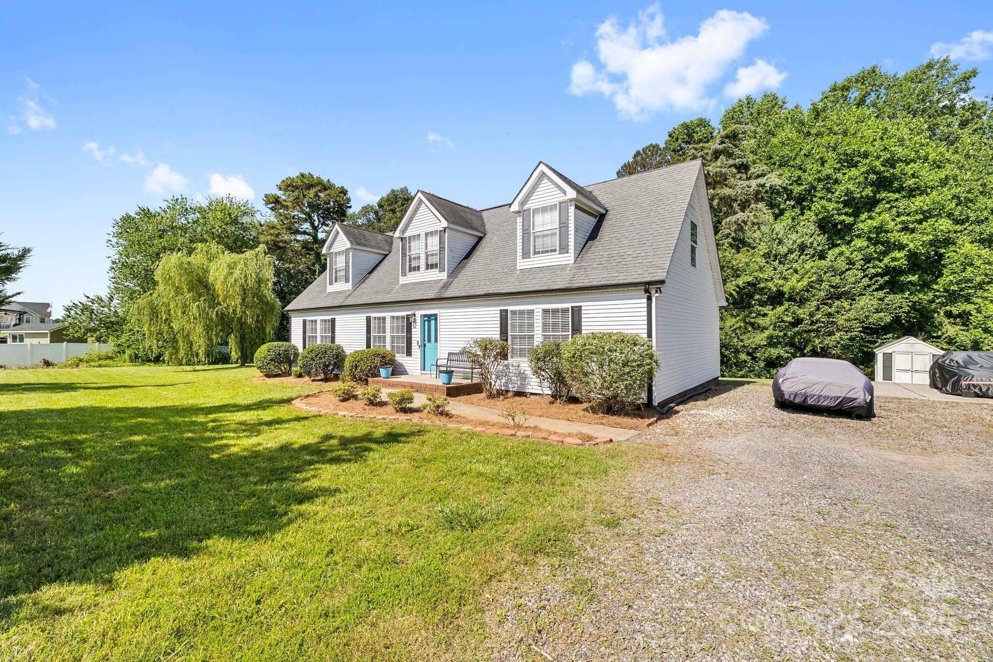 118 Grain Drive Stony Point, NC 28678 - Photo 1 of 31 a front view of a house with swimming pool having outdoor seating