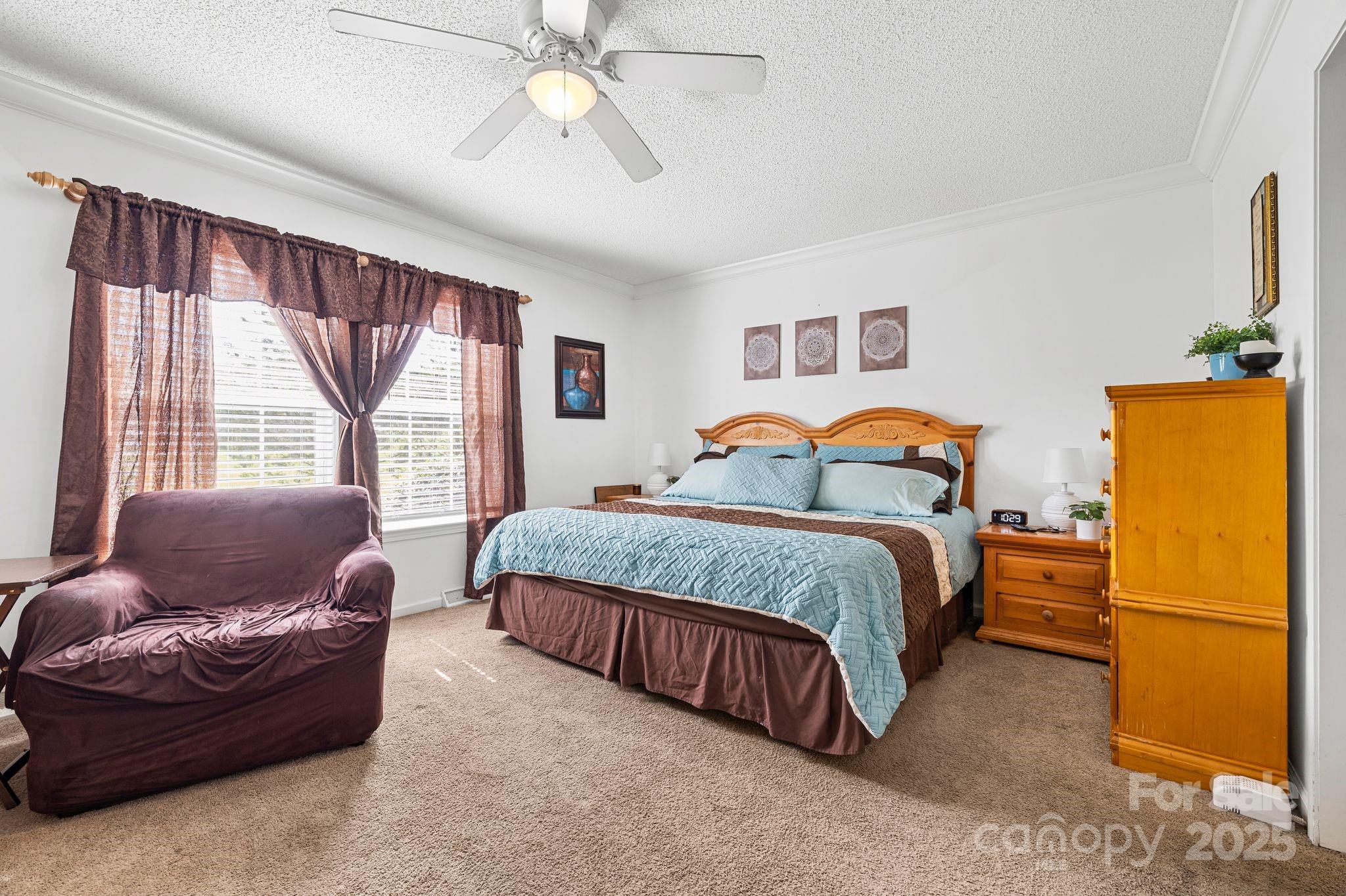 118 Grain Drive Stony Point, NC 28678 - Photo 11 of 31 a bedroom with a bed couch and window