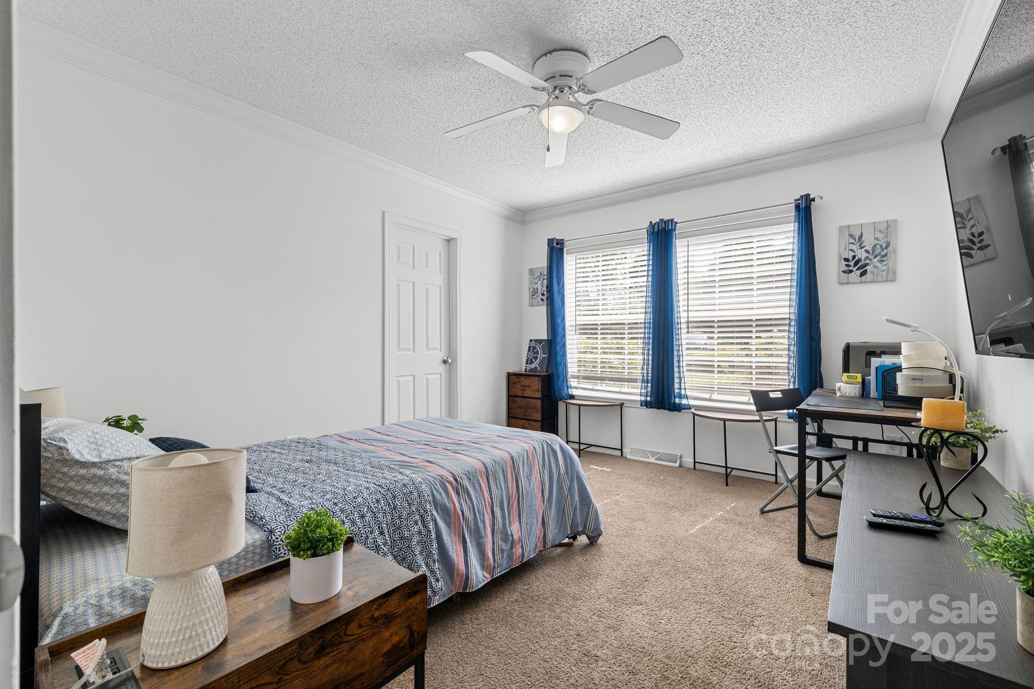 118 Grain Drive Stony Point, NC 28678 - Photo 14 of 31 a bedroom with a bed table chair and a window