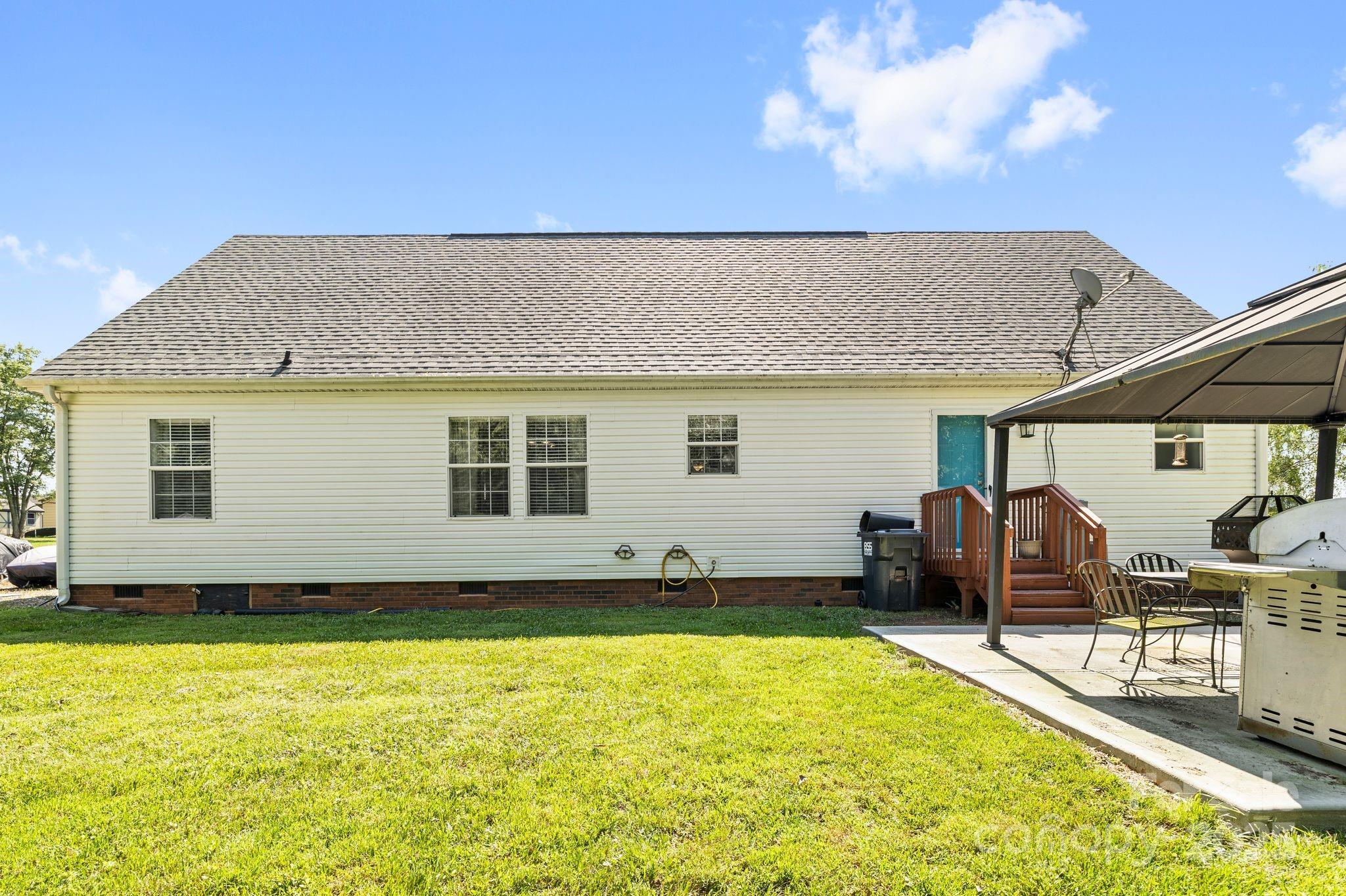 118 Grain Drive Stony Point, NC 28678 - Photo 19 of 31 a front view of a house with a yard