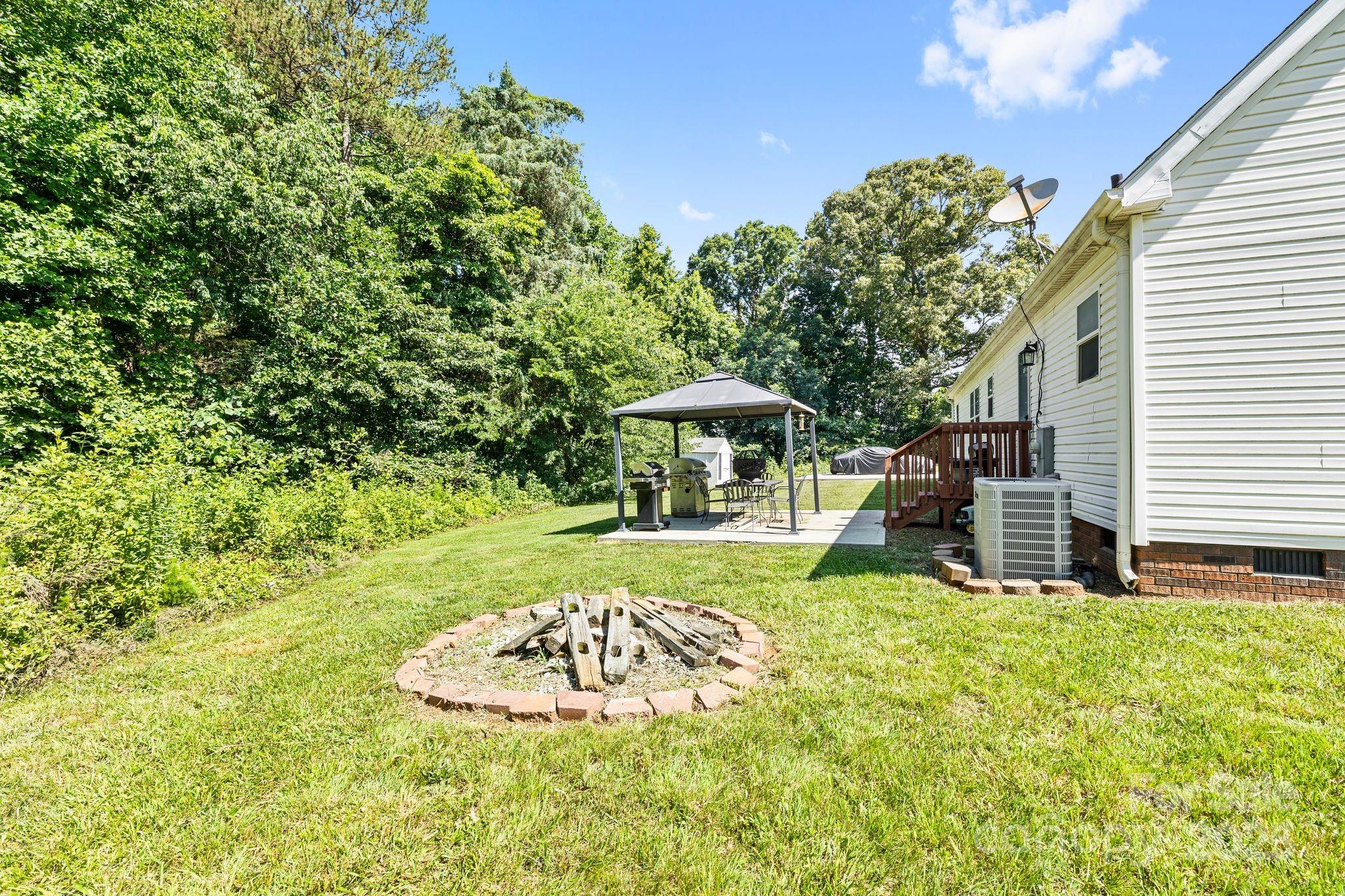 118 Grain Drive Stony Point, NC 28678 - Photo 22 of 31 a swimming pool with barbeque oven outdoor seating yard