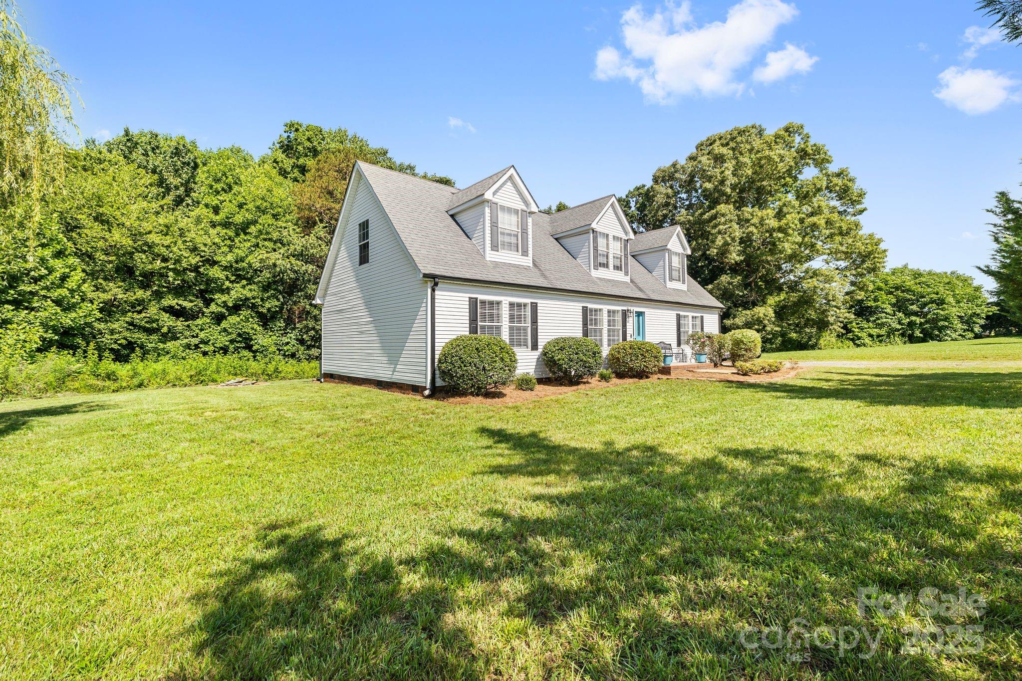 118 Grain Drive Stony Point, NC 28678 - Photo 3 of 31 a front view of a house with a yard