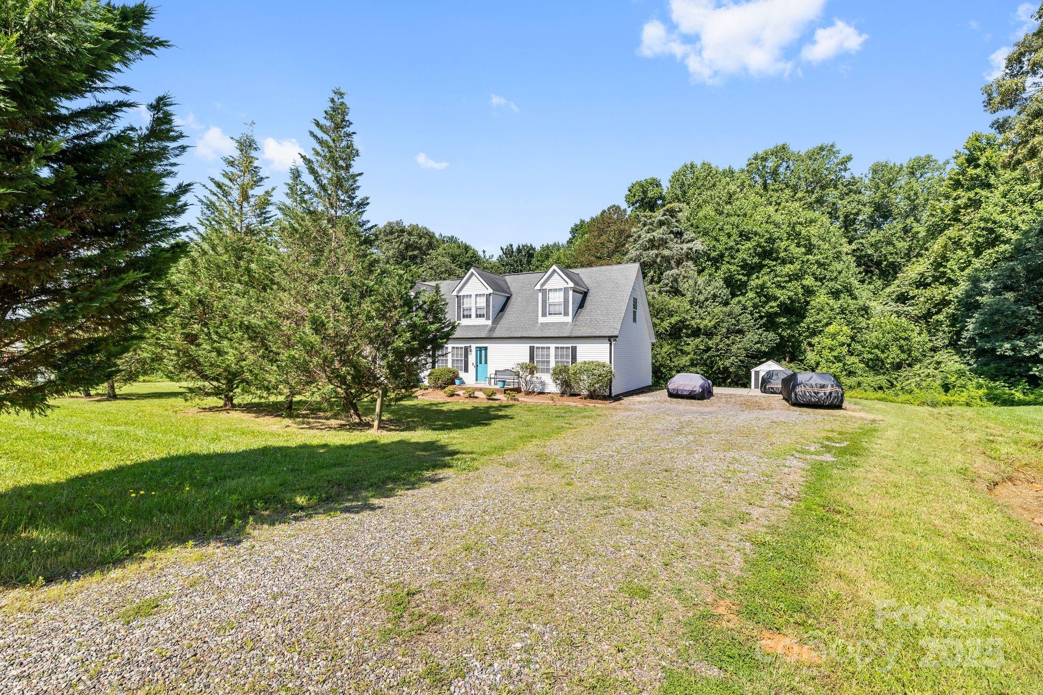 118 Grain Drive Stony Point, NC 28678 - Photo 4 of 31 a swimming pool with trees in the background