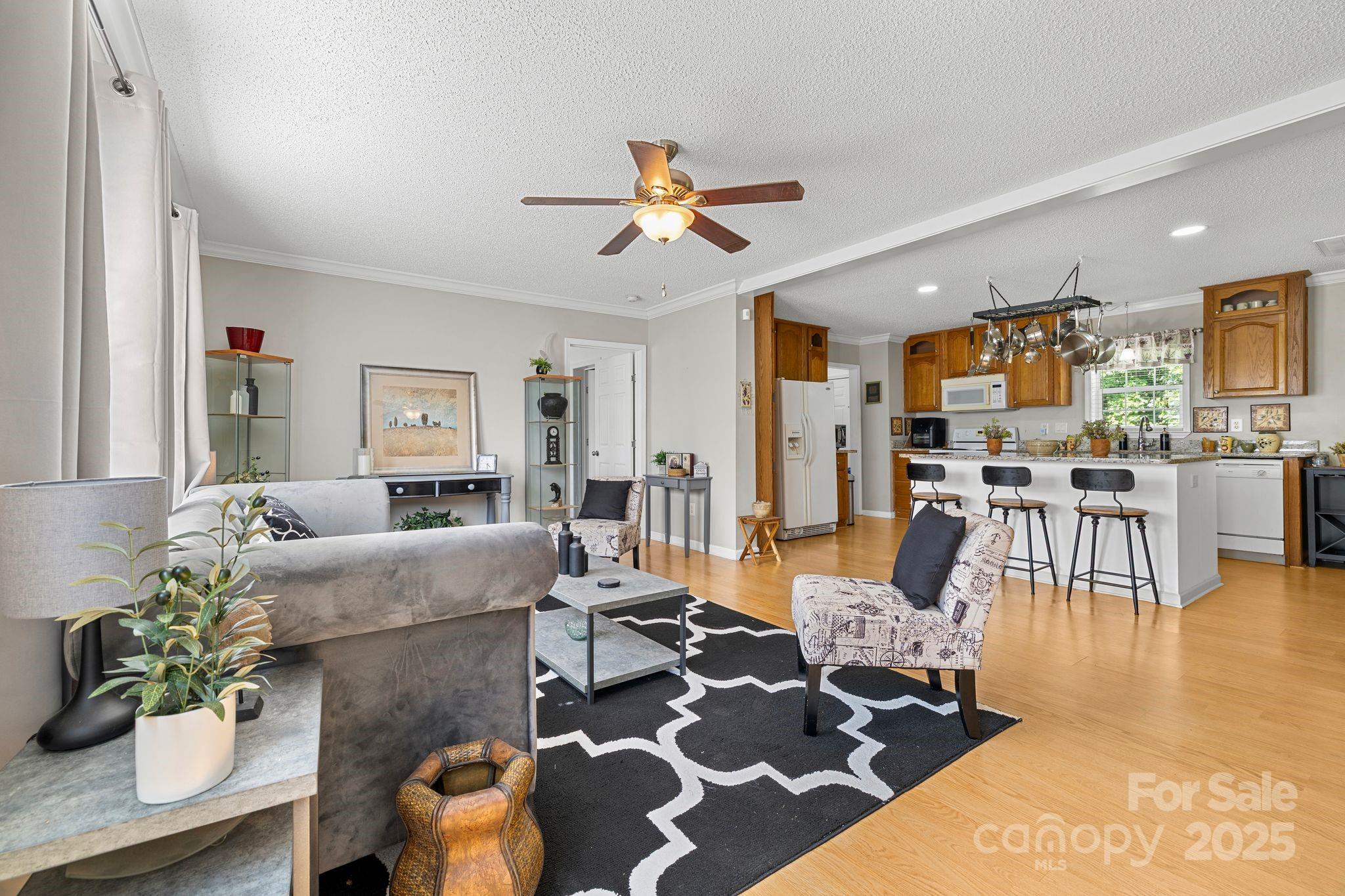 118 Grain Drive Stony Point, NC 28678 - Photo 5 of 31 a living room with furniture and wooden floor
