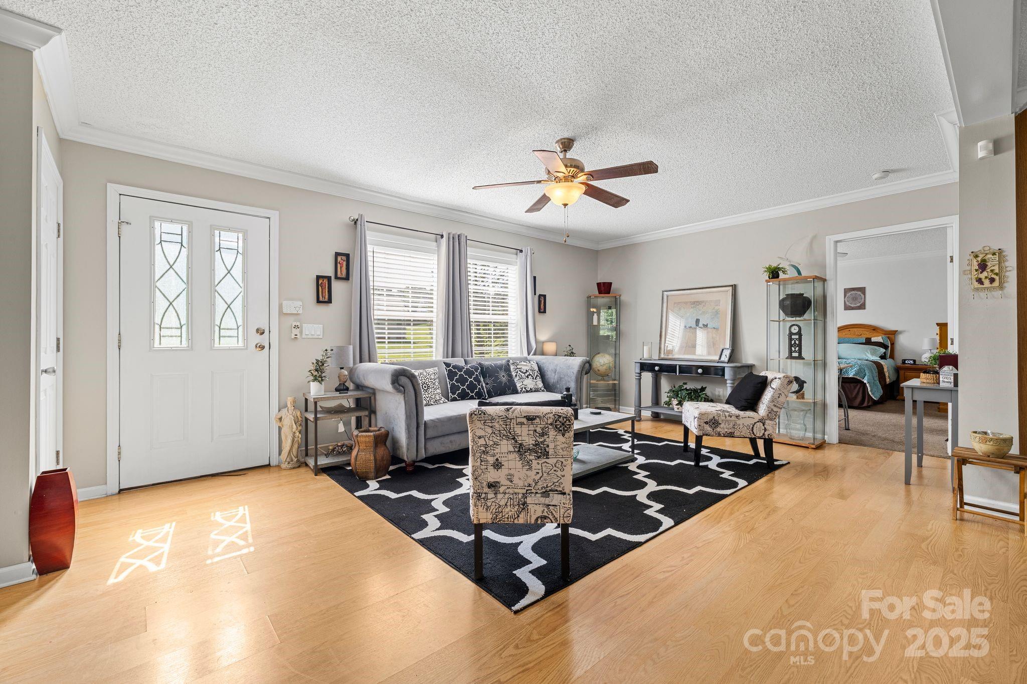 118 Grain Drive Stony Point, NC 28678 - Photo 6 of 31 a living room with furniture a couch and wooden floor