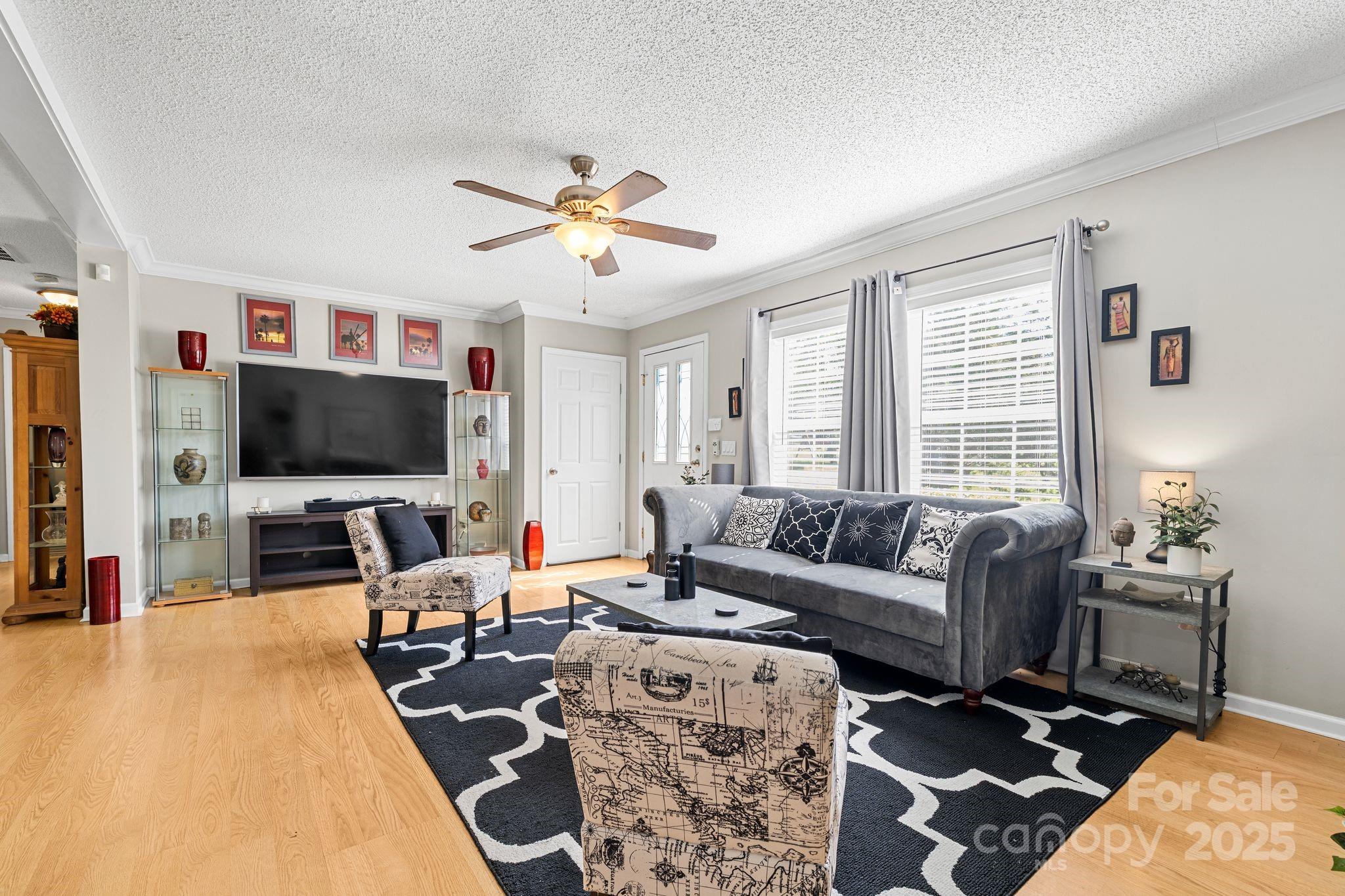 118 Grain Drive Stony Point, NC 28678 - Photo 10 of 31 a living room with furniture and a flat screen tv