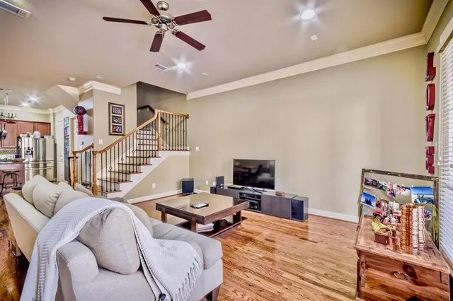 a bedroom with furniture and a flat screen tv