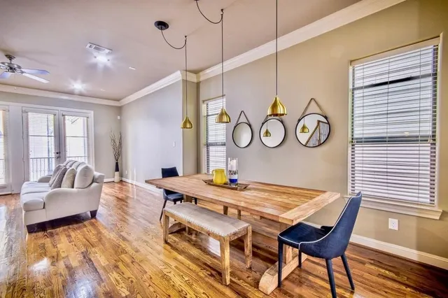 a view of a dining room with furniture and wooden floor