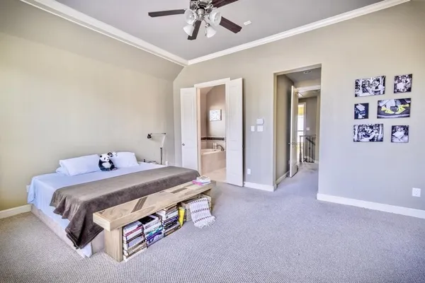a bed room with a bed and a chandelier