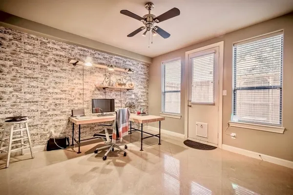 a work room with furniture and a fireplace