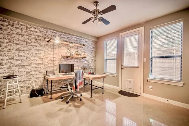 a work room with furniture and a fireplace