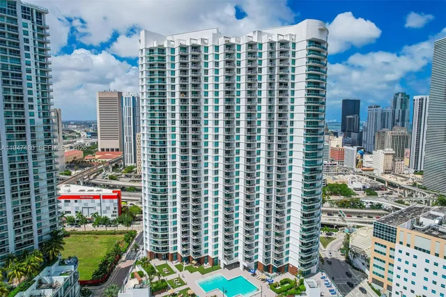 a view of building with outdoor space and garden view