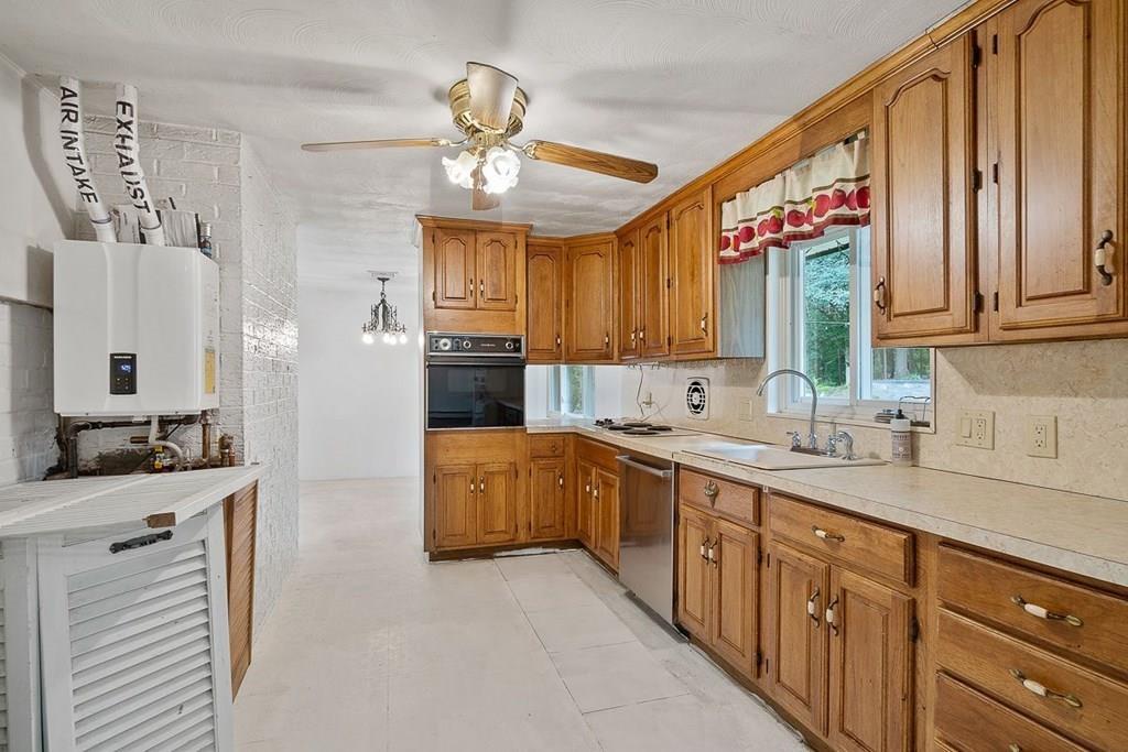 9 Temi Road Chelmsford, MA 01824 - Photo 12 of 28 a kitchen with a sink stove and cabinets