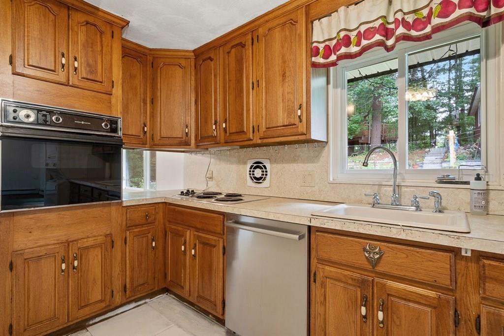 9 Temi Road Chelmsford, MA 01824 - Photo 13 of 28 a kitchen with a sink cabinets and window