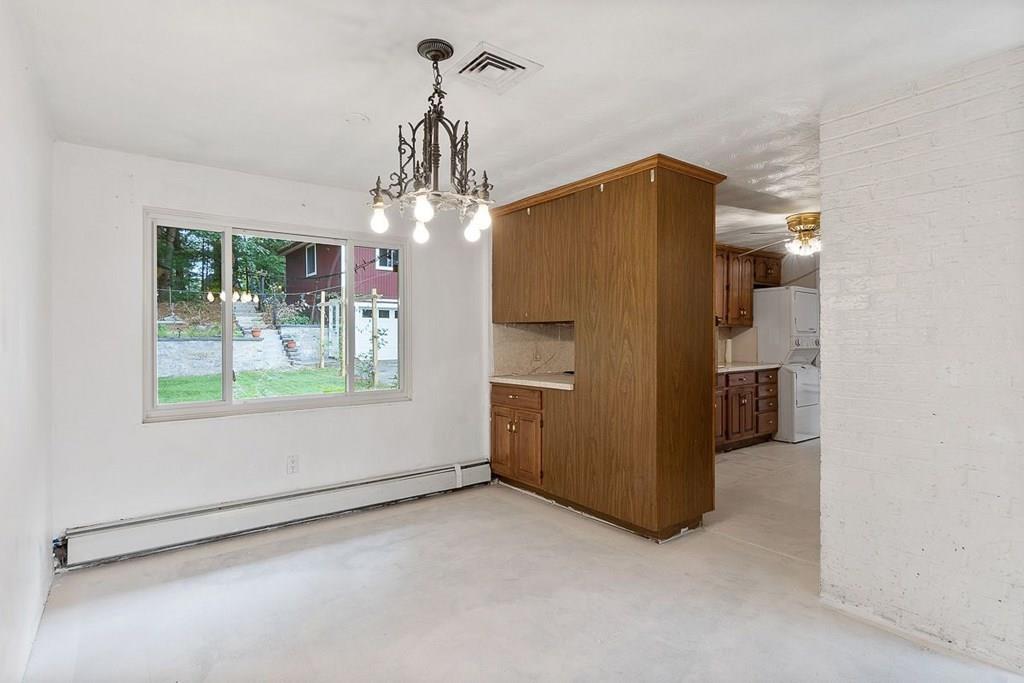9 Temi Road Chelmsford, MA 01824 - Photo 15 of 28 an empty room with windows and ceiling fan