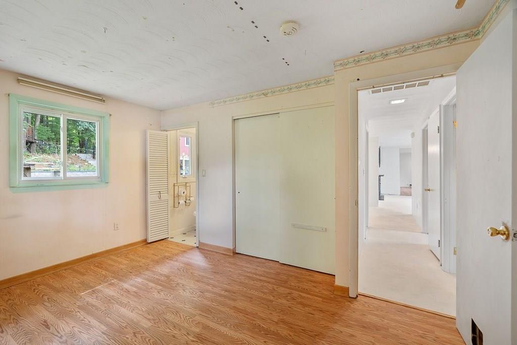9 Temi Road Chelmsford, MA 01824 - Photo 16 of 28 a view of an empty room with wooden floor and a window