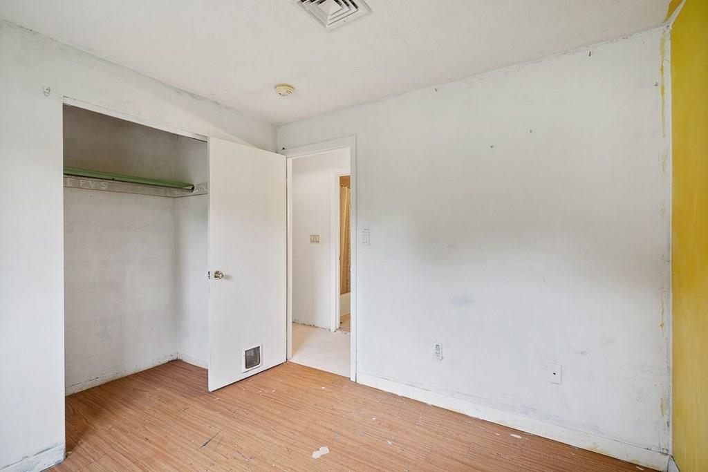 9 Temi Road Chelmsford, MA 01824 - Photo 19 of 28 a view of an empty room with wooden floor and a window