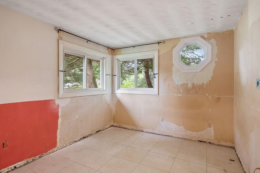 9 Temi Road Chelmsford, MA 01824 - Photo 20 of 28 a view of an empty room with a window