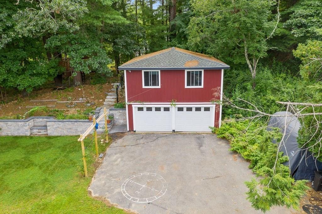 9 Temi Road Chelmsford, MA 01824 - Photo 26 of 28 a house with river in front of it