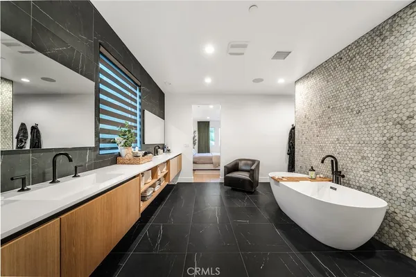 a bathroom with a bathtub and a sink