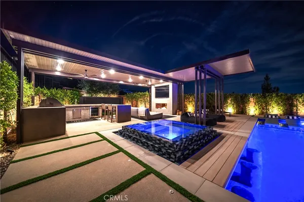 a view of a backyard with garden and patio