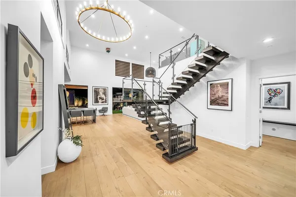 a living room with large window and furniture