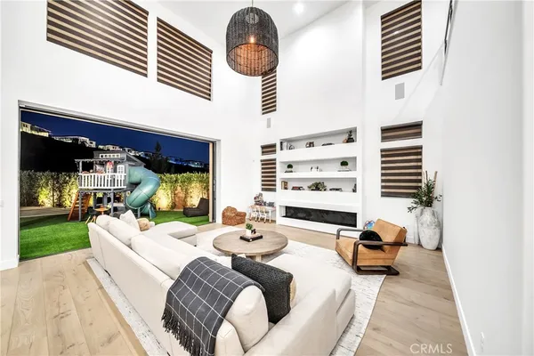 a view of living room with furniture and large window