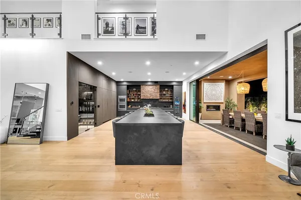 a large kitchen with stainless steel appliances sitting on counter top