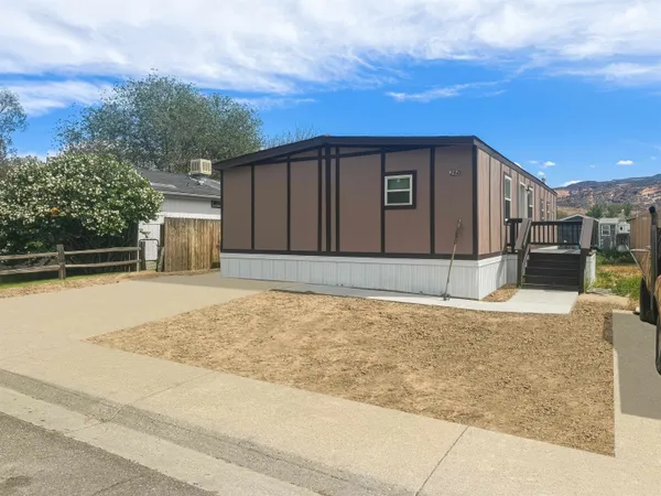 a view of a backyard of the house