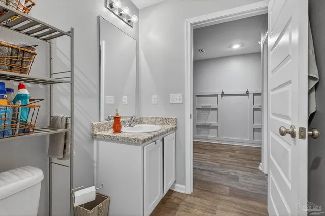 a bedroom with a bed and a book shelf