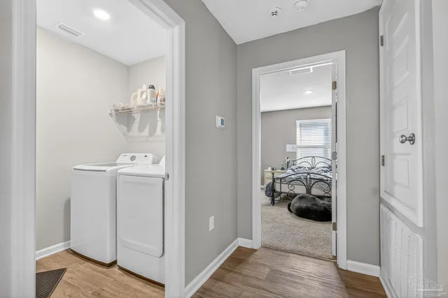 a view of a dining room with furniture and a book shelf