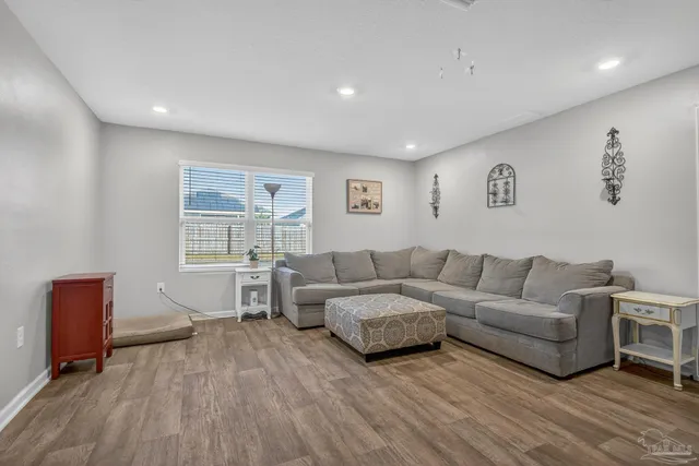 a bedroom with a bed and a book shelf