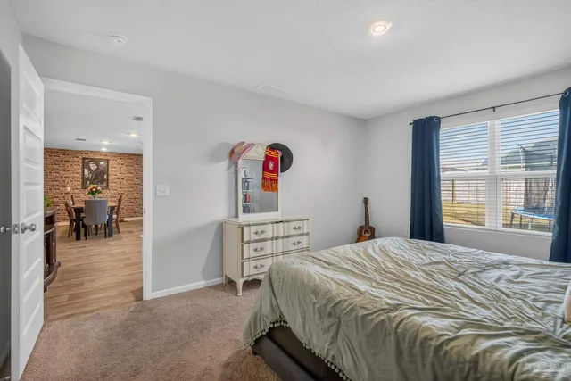 a view of a gallery with hallway and closet