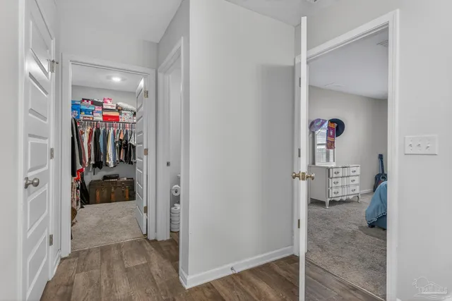 a view of a house with swimming pool and sitting area