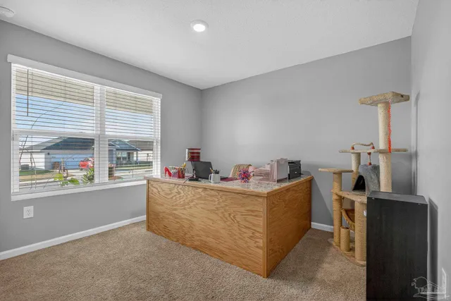 a living room with furniture and window