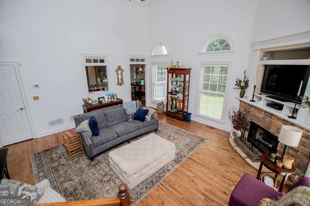 204 Pinehurst Way Carrollton, GA 30116 - Photo 12 of 61 a living room with furniture and a flat screen tv