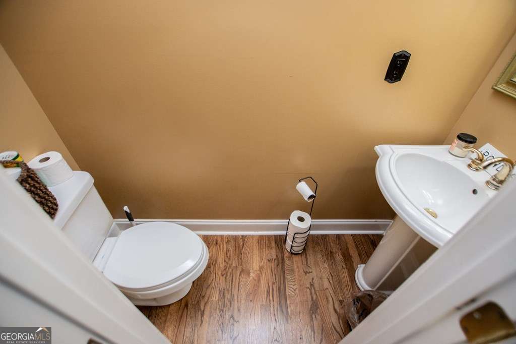 204 Pinehurst Way Carrollton, GA 30116 - Photo 13 of 61 a bathroom with a toilet a sink and mirror