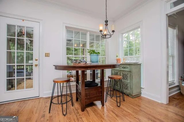 a bed room with a bed and a chandelier