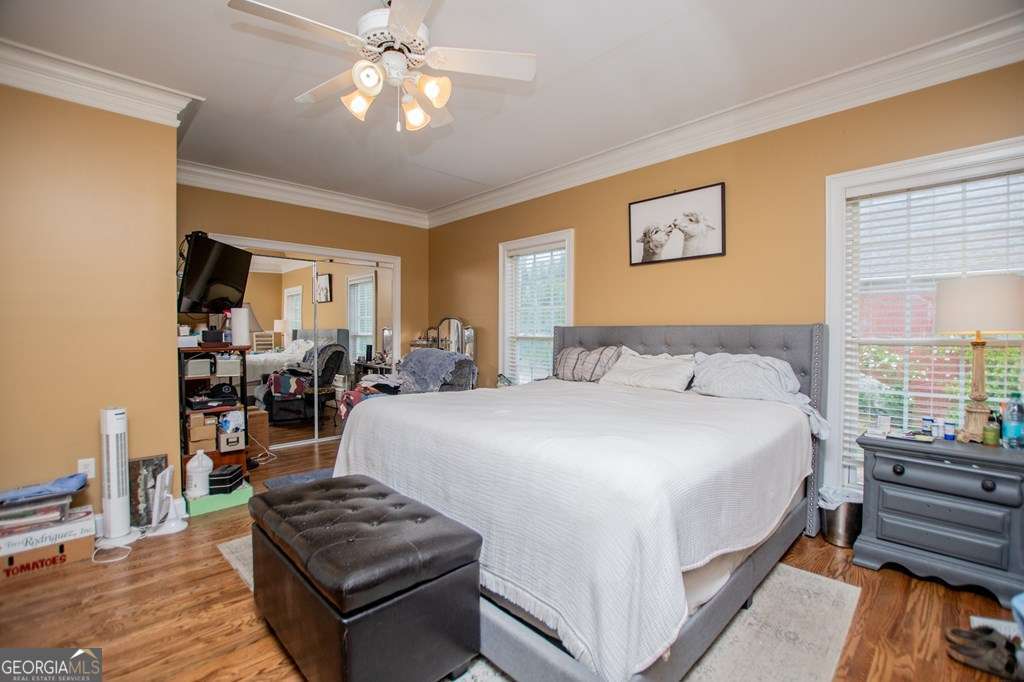 204 Pinehurst Way Carrollton, GA 30116 - Photo 19 of 61 a bed room with a bed and a chandelier