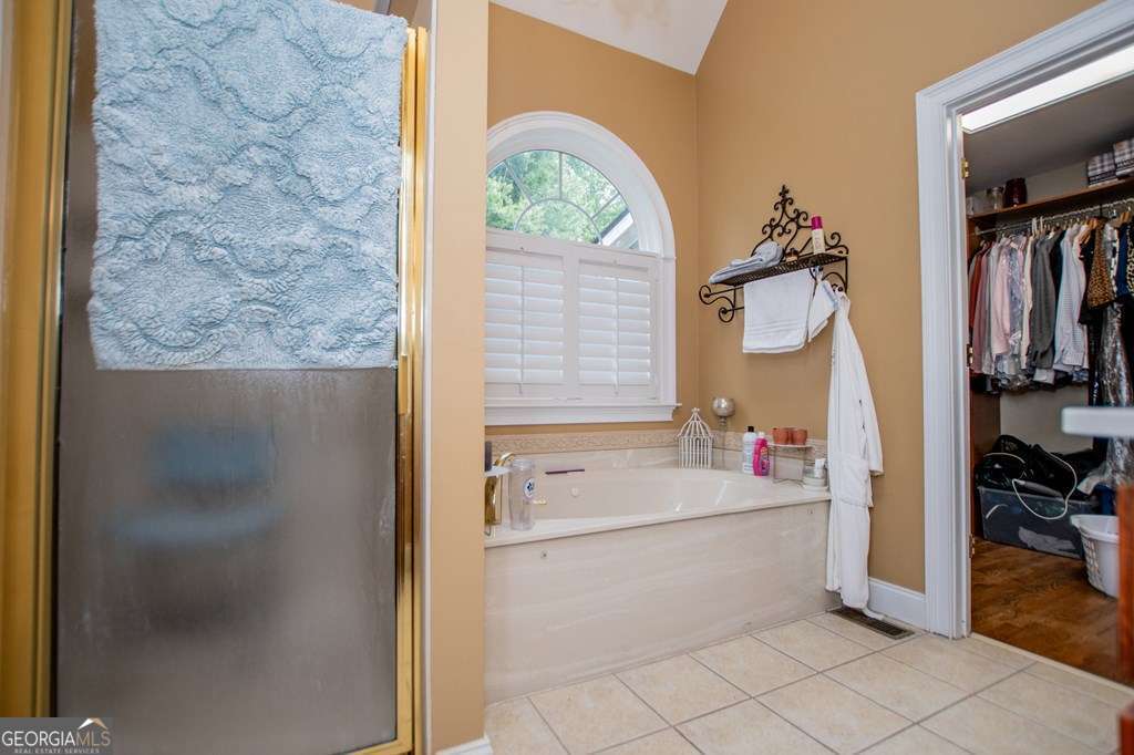204 Pinehurst Way Carrollton, GA 30116 - Photo 22 of 61 a bathroom with a sink a toilet and a shower