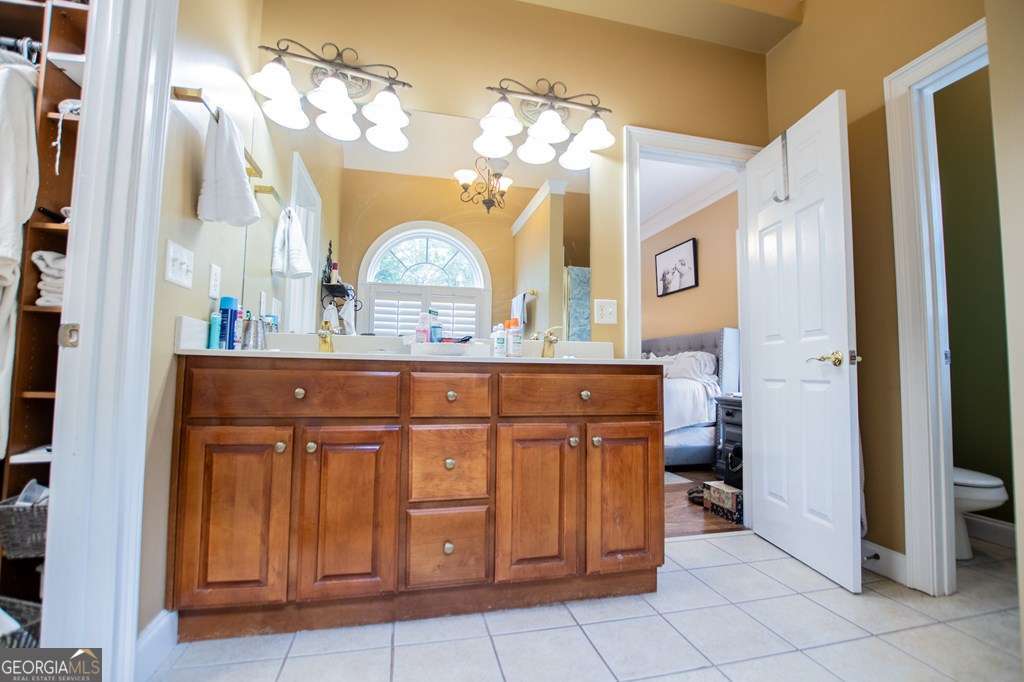 204 Pinehurst Way Carrollton, GA 30116 - Photo 23 of 61 a bathroom with a sink a vanity and a mirror