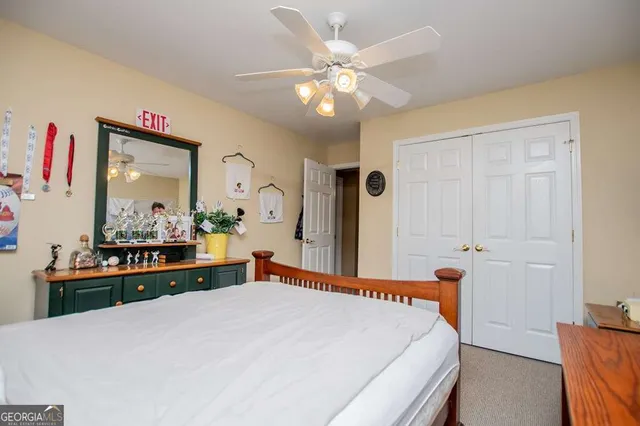 a view of a bedroom with furniture window and fireplace